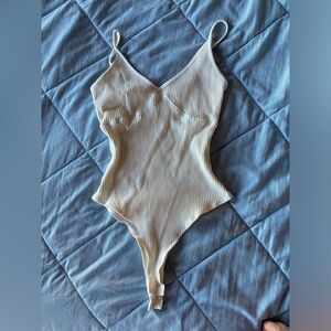 Polly cream body suit size 6